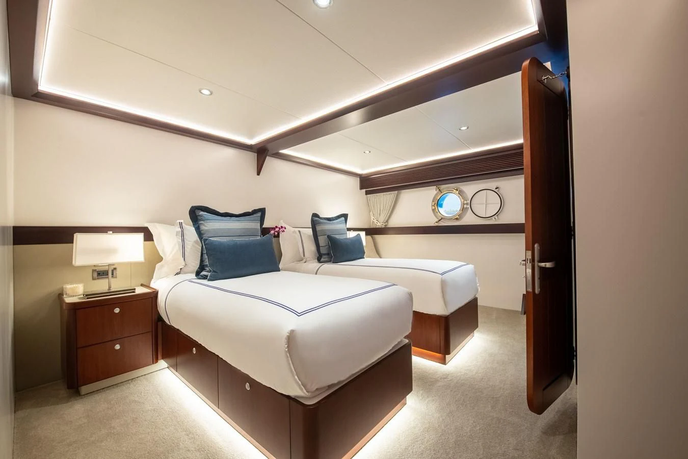 a bedroom with a bed and a desk aboard LATITUDE Yacht for Sale