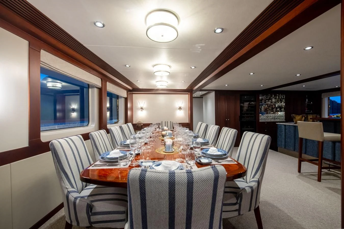 a restaurant with tables and chairs aboard LATITUDE Yacht for Sale