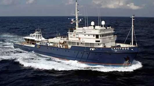 a large ship in the water aboard LATITUDE Yacht for Sale