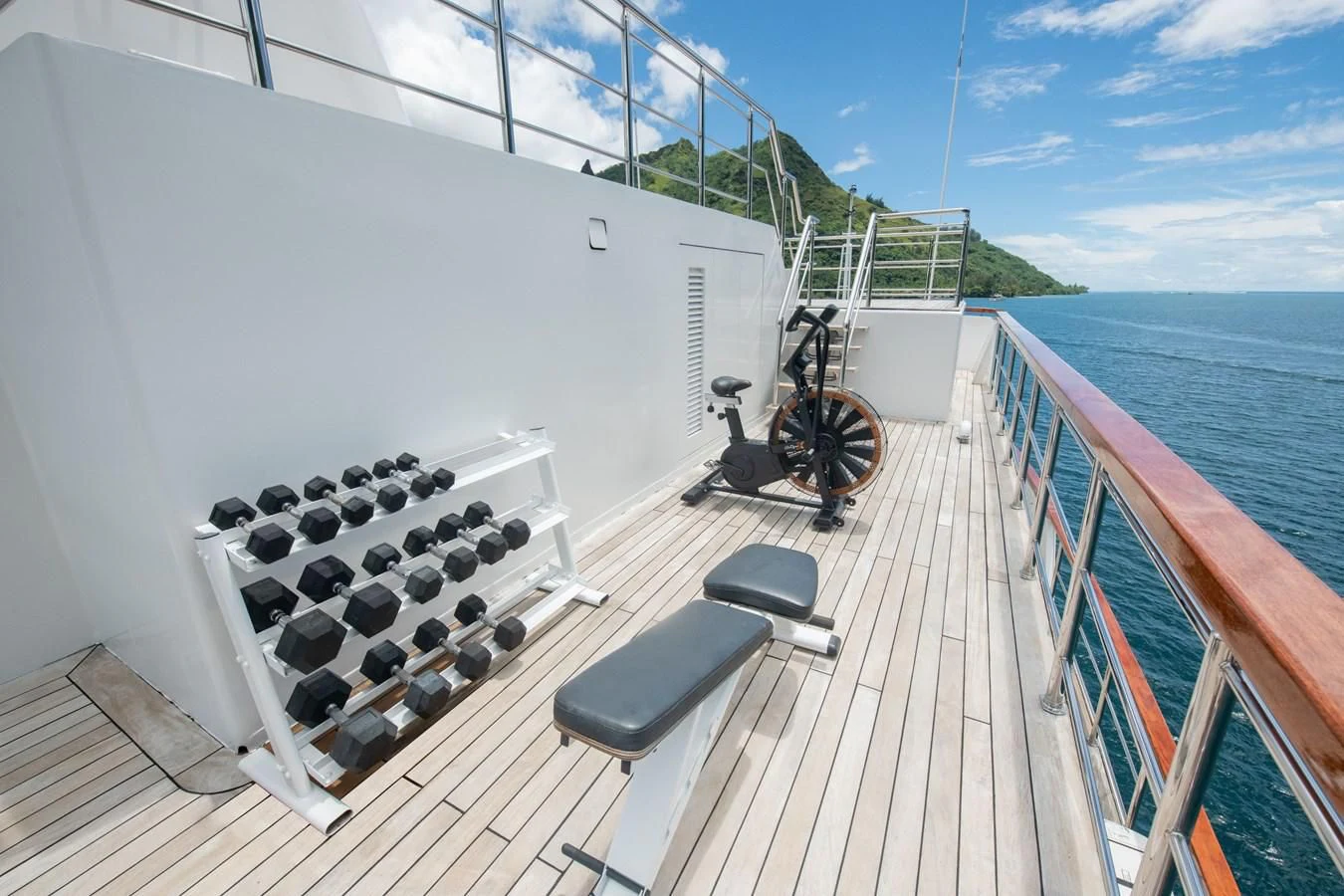 a deck with a chair and a computer on it aboard LATITUDE Yacht for Sale