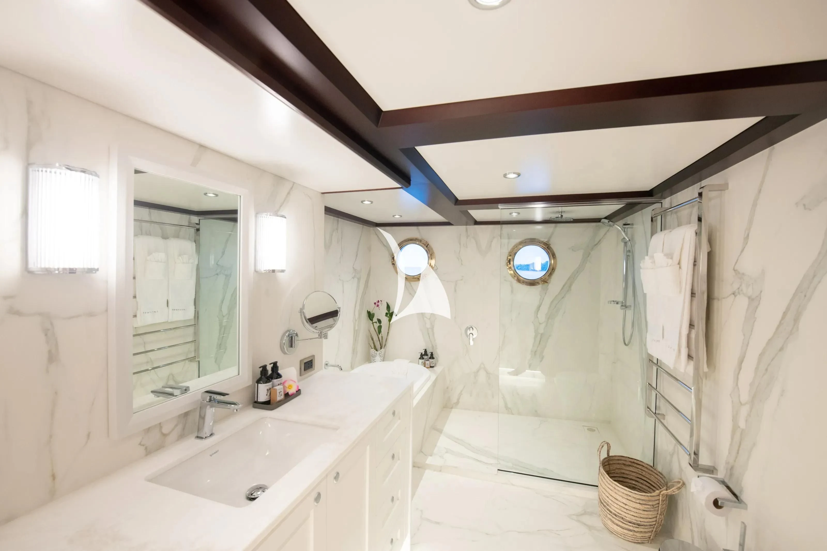 a bathroom with a tub sink and mirror aboard LATITUDE Yacht for Sale
