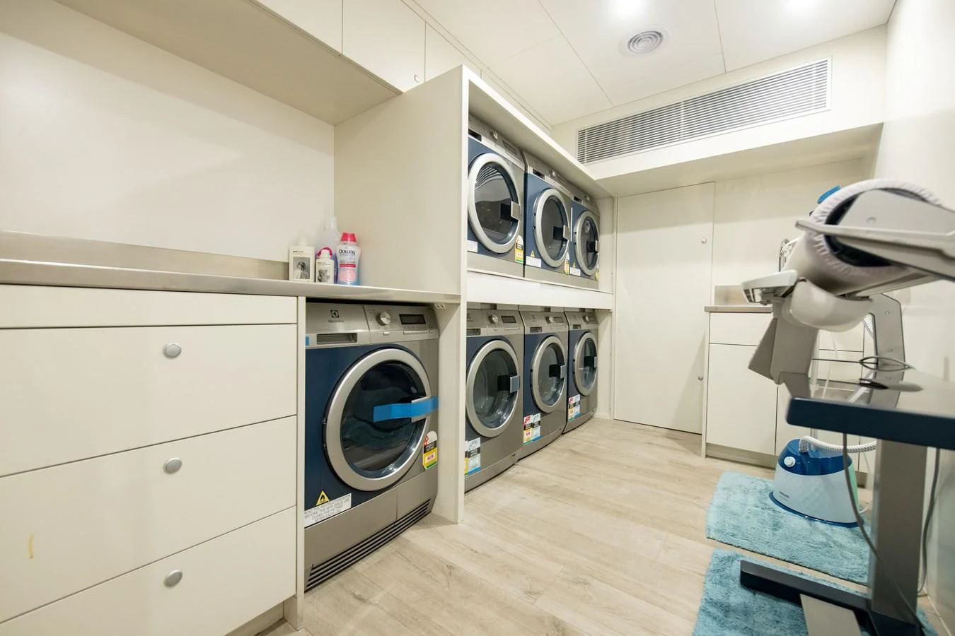 a white kitchen with a large oven aboard LATITUDE Yacht for Sale