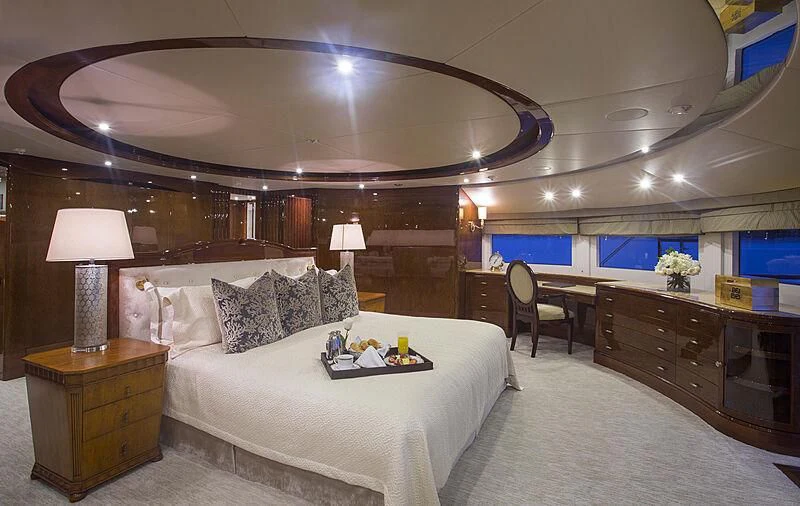 a large bedroom with a large bed aboard DOMANI Yacht for Sale