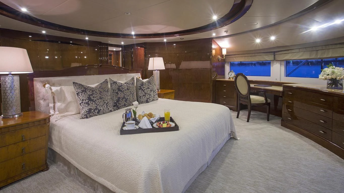 a large bed in a room aboard DOMANI Yacht for Sale