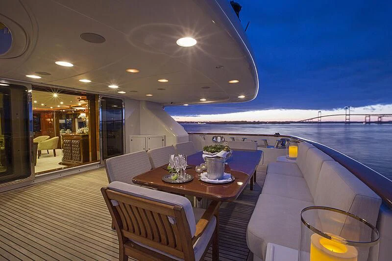 a table and chairs on a boat aboard DOMANI Yacht for Sale