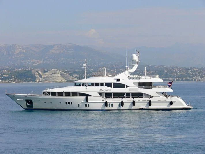 a white yacht in the water aboard DOMANI Yacht for Sale