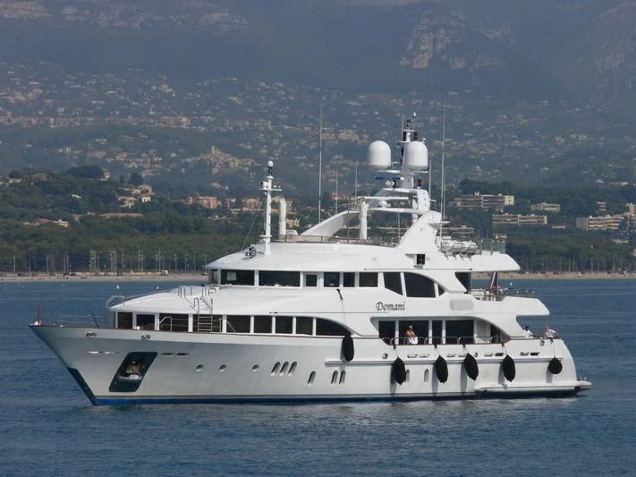 a white boat in the water aboard DOMANI Yacht for Sale