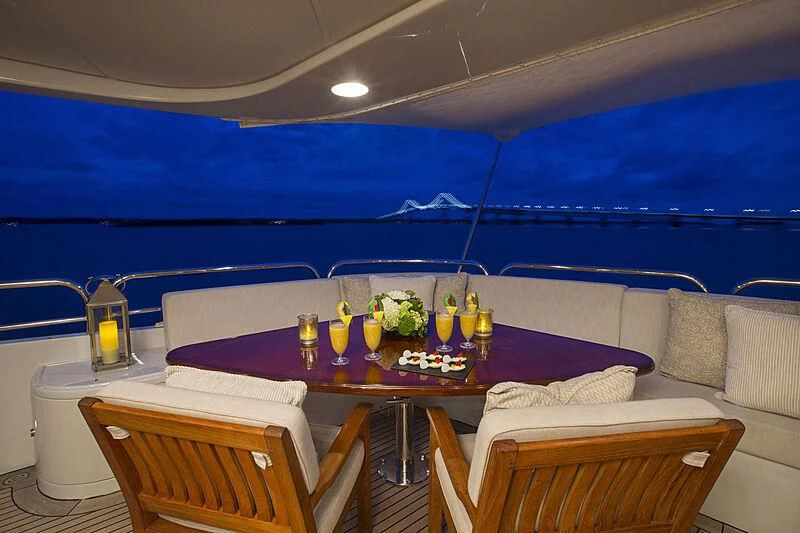 a table with candles on it aboard DOMANI Yacht for Sale