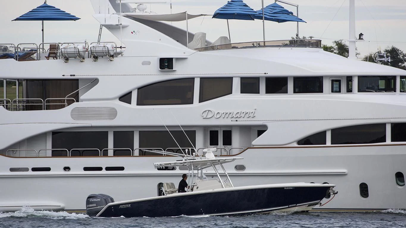 a boat is parked on the shore aboard DOMANI Yacht for Sale
