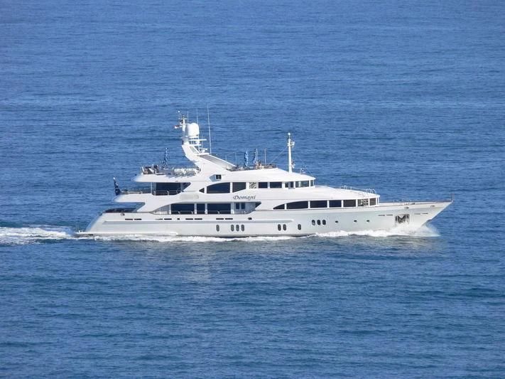 a white boat on the water aboard DOMANI Yacht for Sale