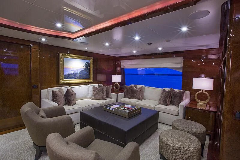 a living room with a large screen aboard DOMANI Yacht for Sale