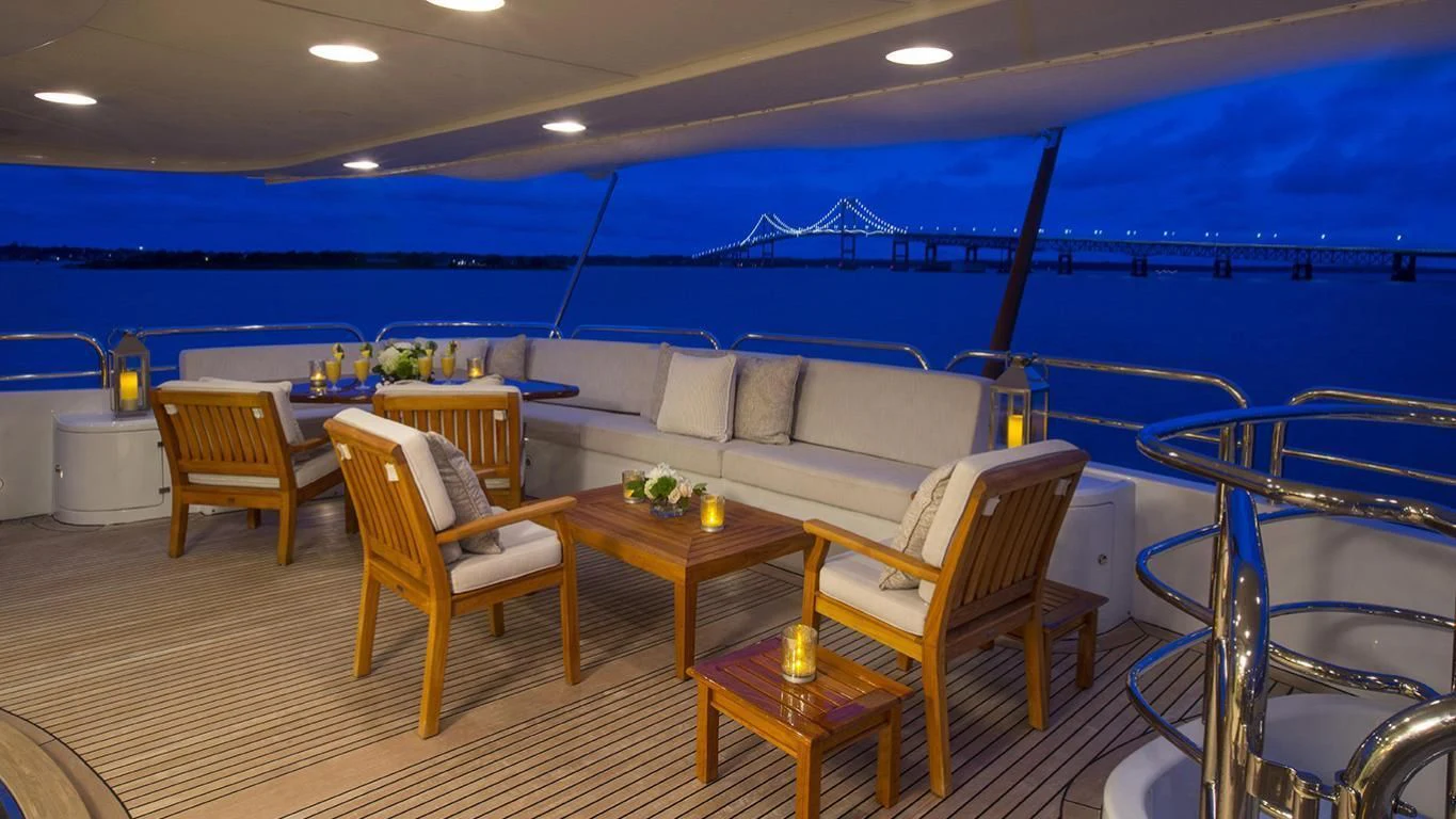 a room with a couch and chairs aboard DOMANI Yacht for Sale