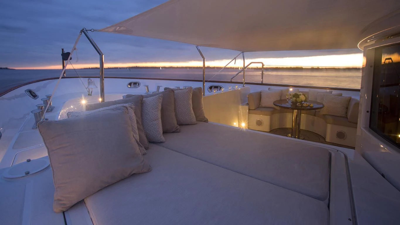 a large bed with a white bed aboard DOMANI Yacht for Sale