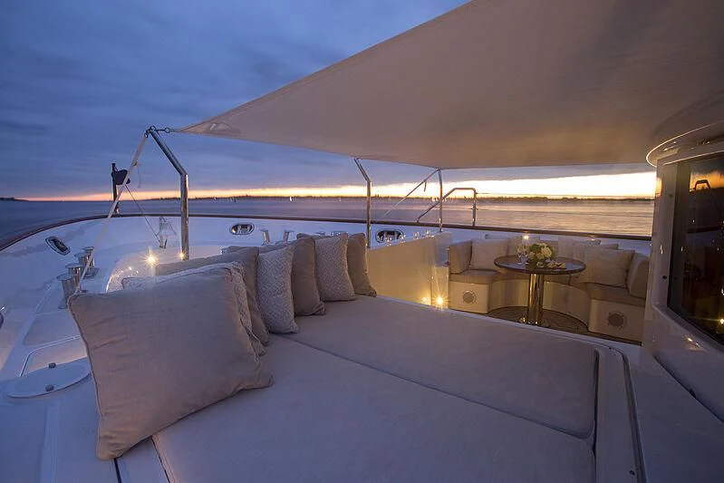 a large bed with a white bed aboard DOMANI Yacht for Sale