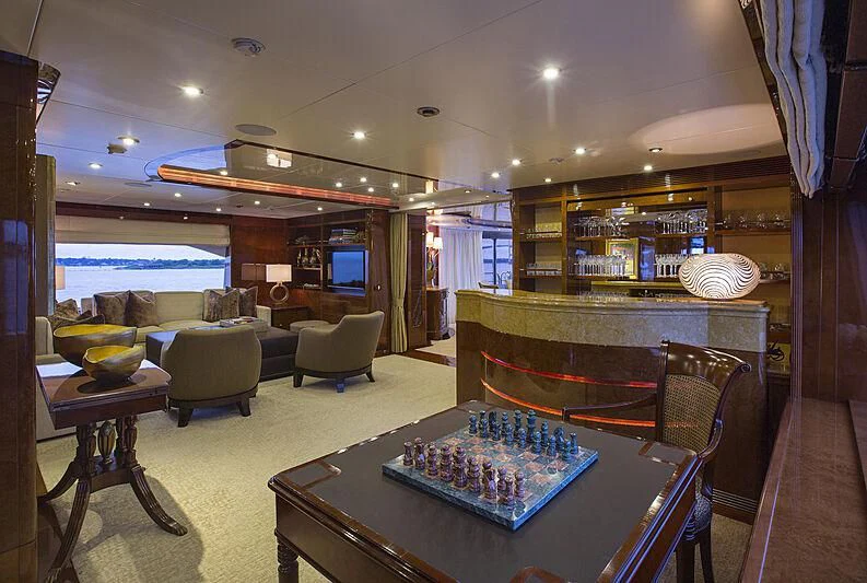 a living room with a large glass window aboard DOMANI Yacht for Sale