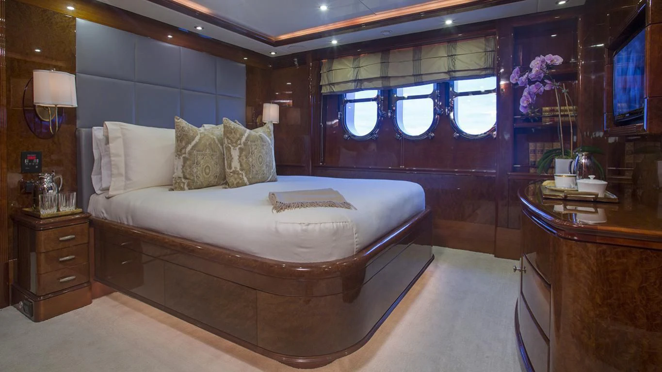 a large bedroom with a large bed aboard DOMANI Yacht for Sale