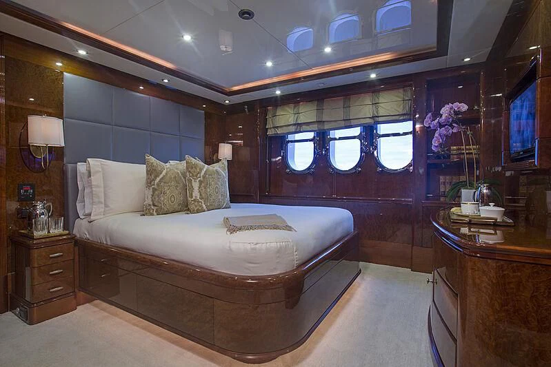 a large bedroom with a large bed aboard DOMANI Yacht for Sale