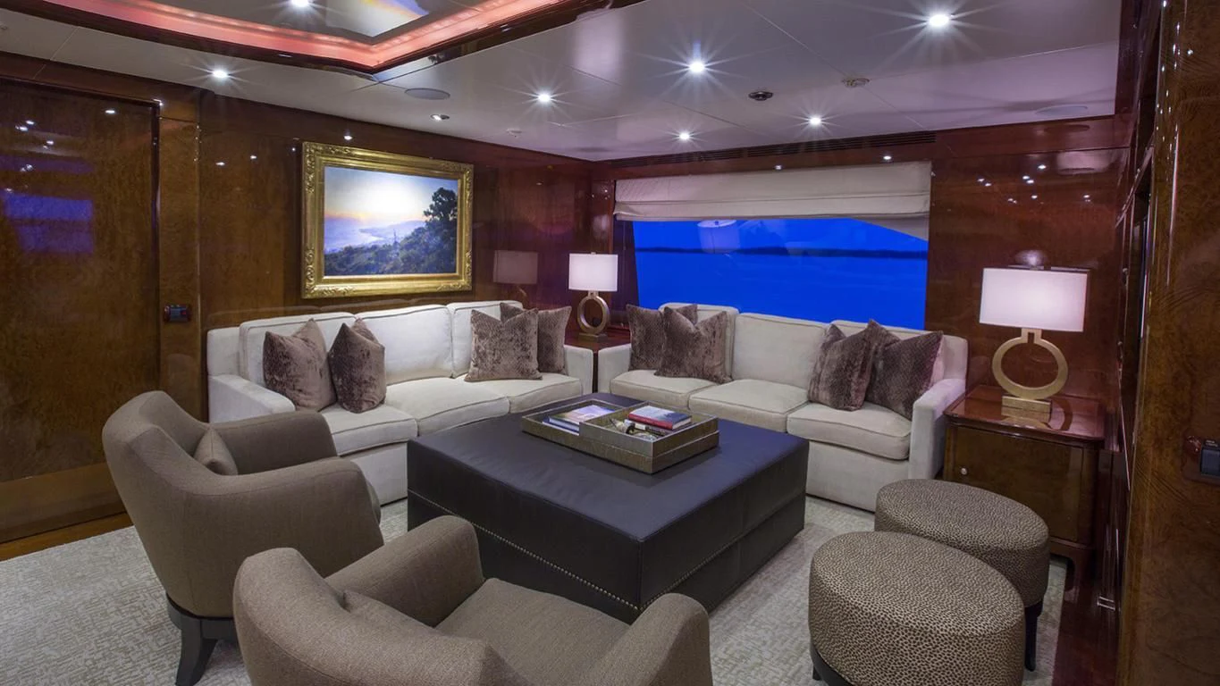 a living room with a large blue screen aboard DOMANI Yacht for Sale