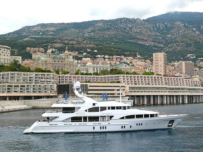 a white yacht in the water aboard DOMANI Yacht for Sale