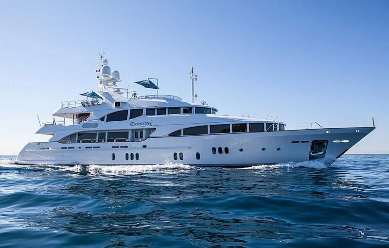 a large white boat in the water aboard DOMANI Yacht for Sale