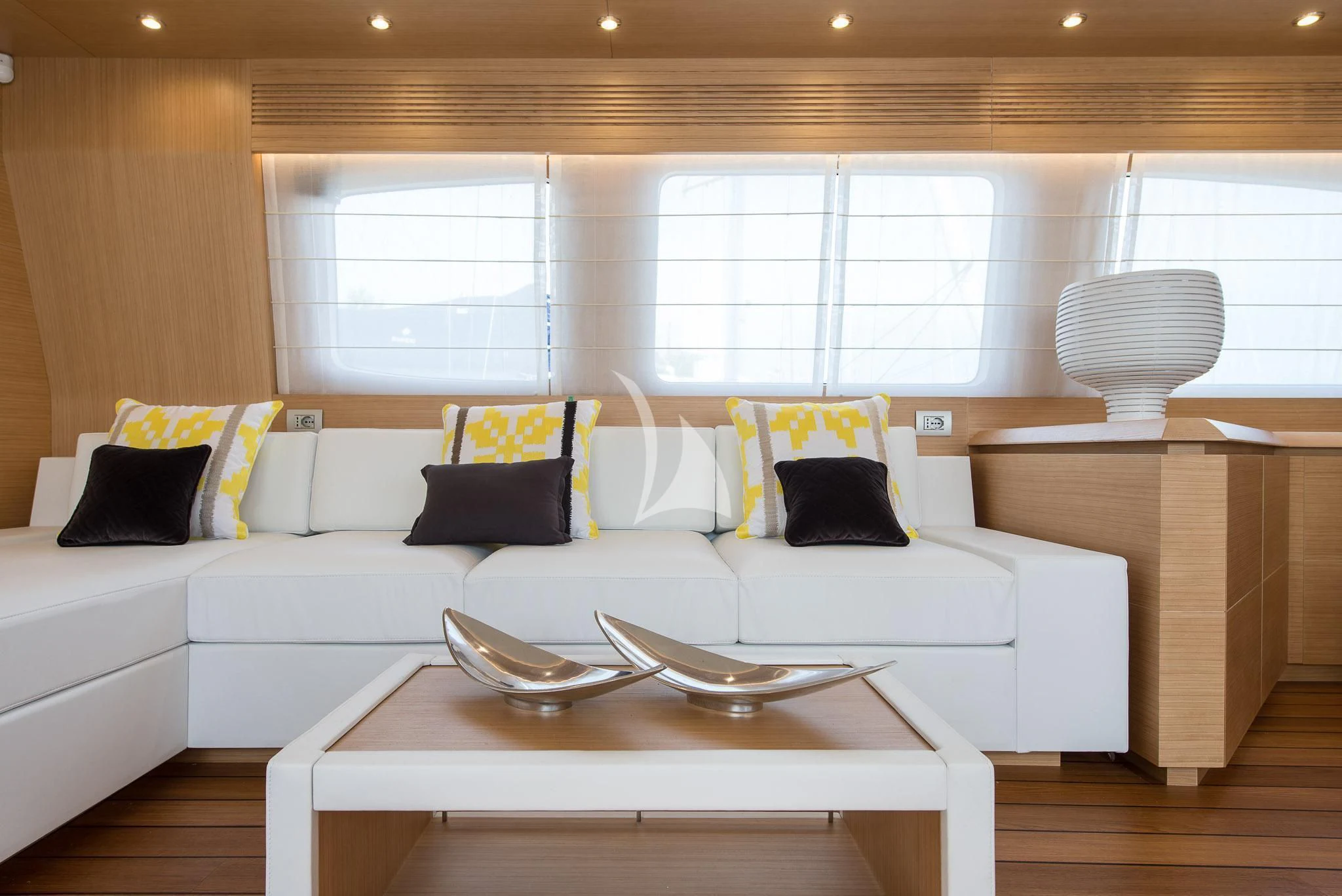 a living room with a white couch aboard MIREDO Yacht for Sale
