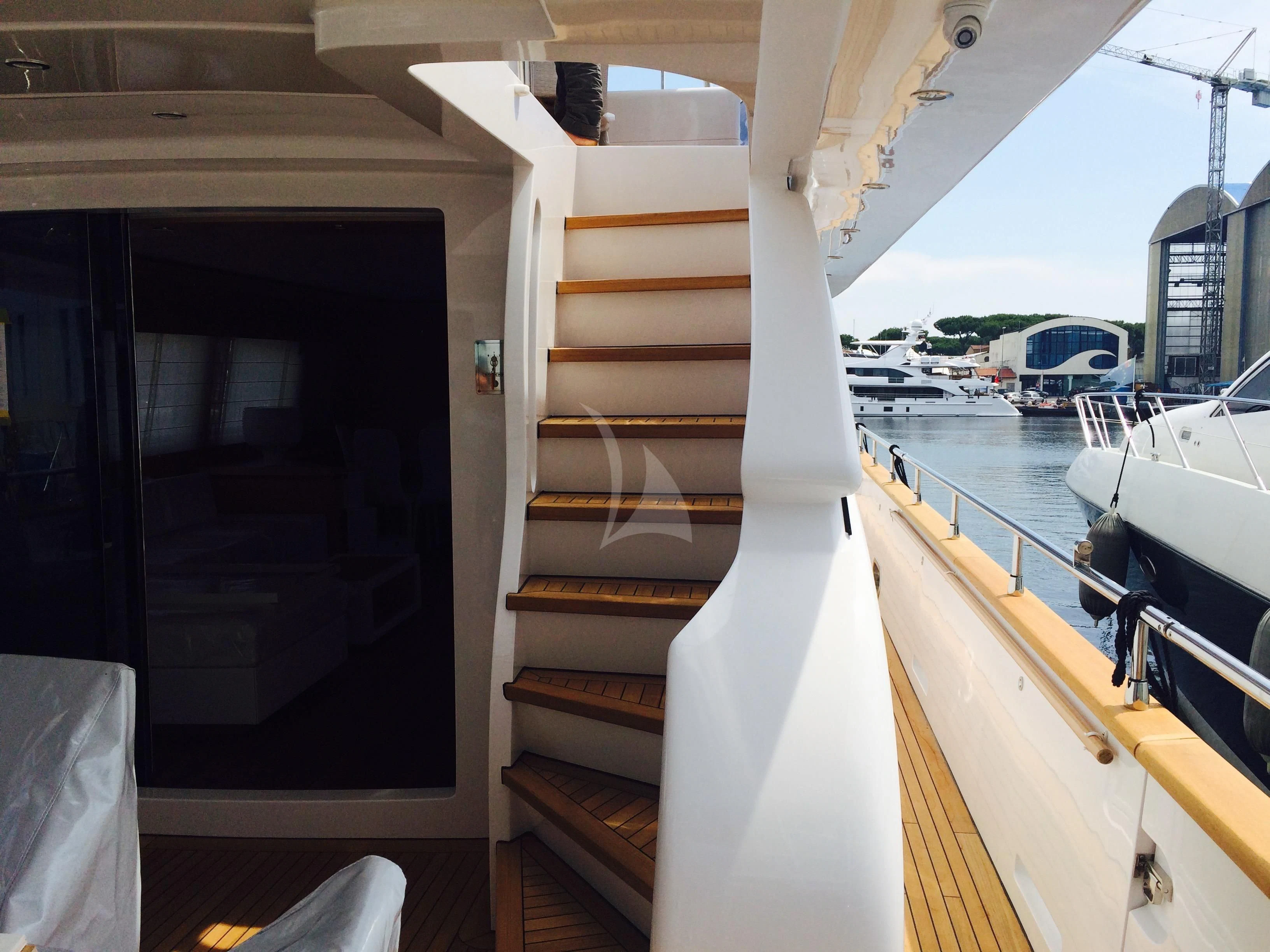 a wooden staircase in a boat aboard MIREDO Yacht for Sale
