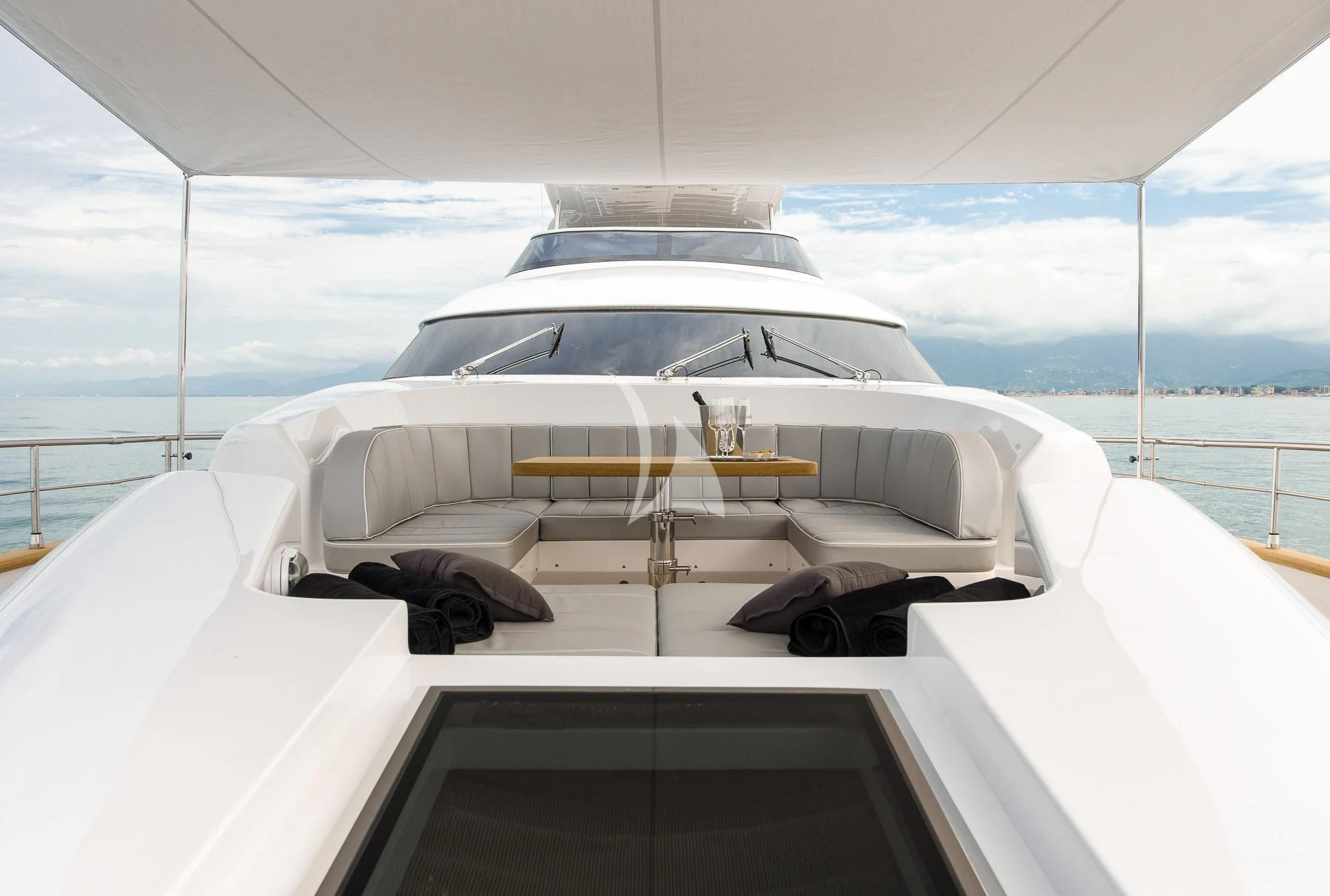 a white yacht on a deck aboard MIREDO Yacht for Sale