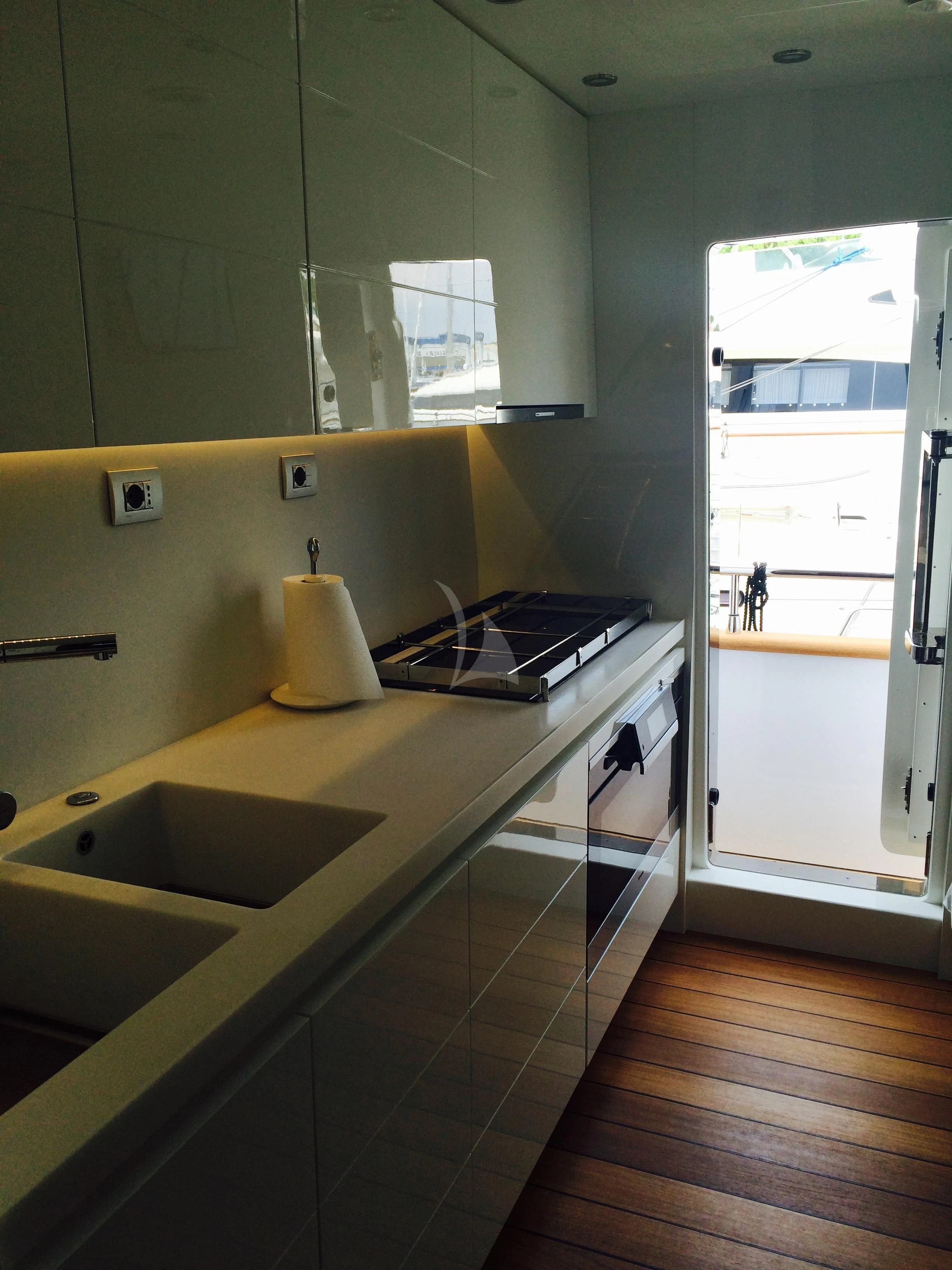 a kitchen with a sink and stove aboard MIREDO Yacht for Sale