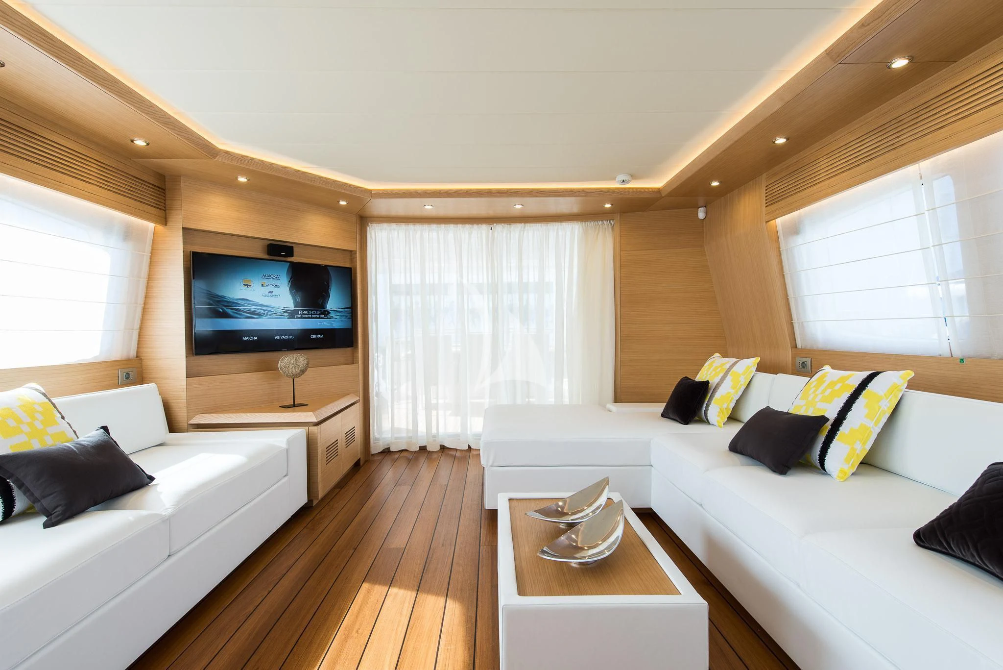 a living room with a large television aboard MIREDO Yacht for Sale