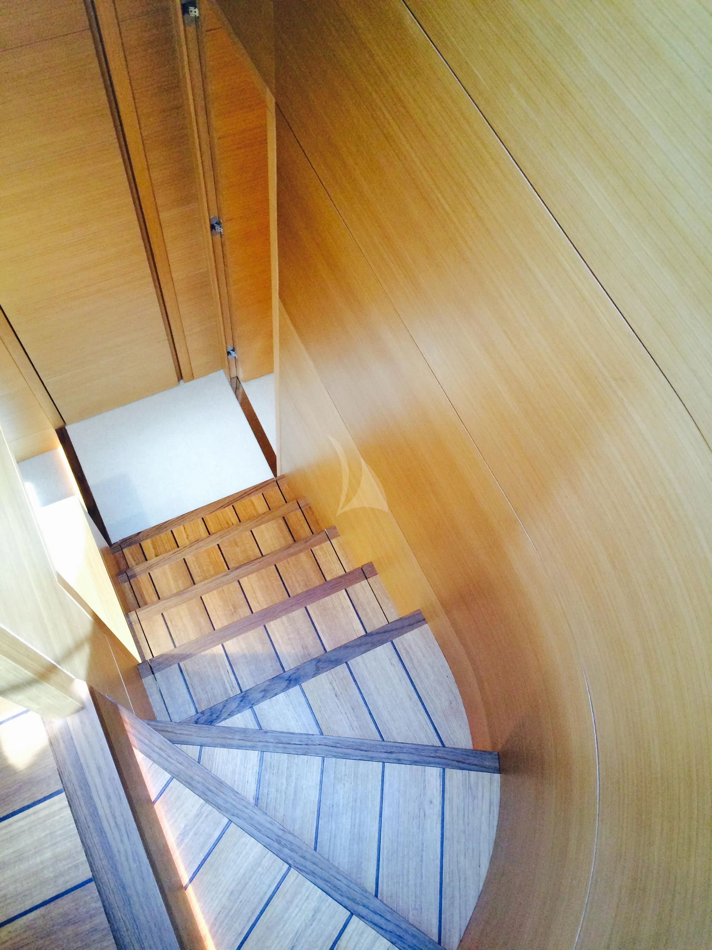 a set of stairs with a wood floor aboard MIREDO Yacht for Sale