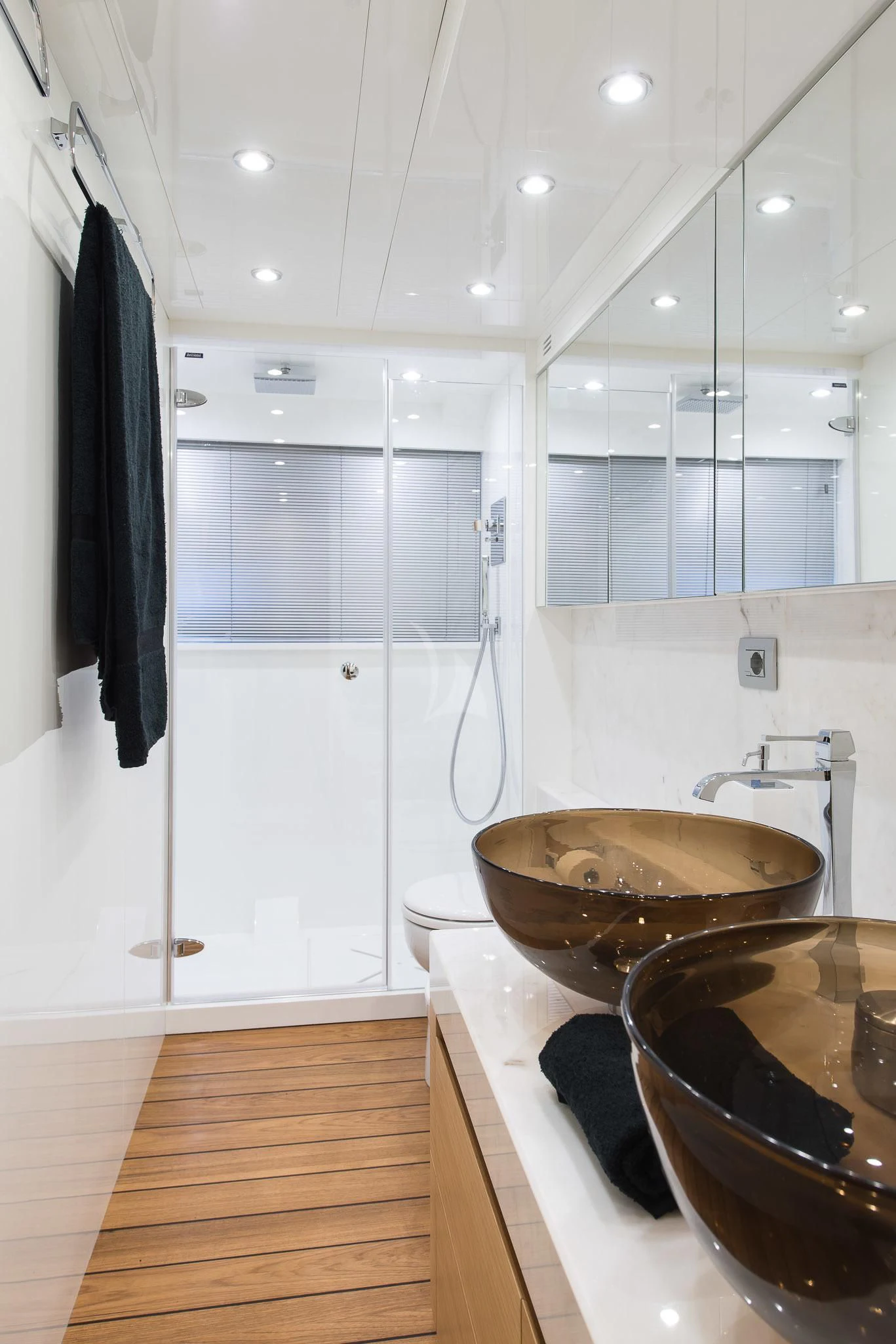 a bathroom with a sink and a large mirror aboard MIREDO Yacht for Sale