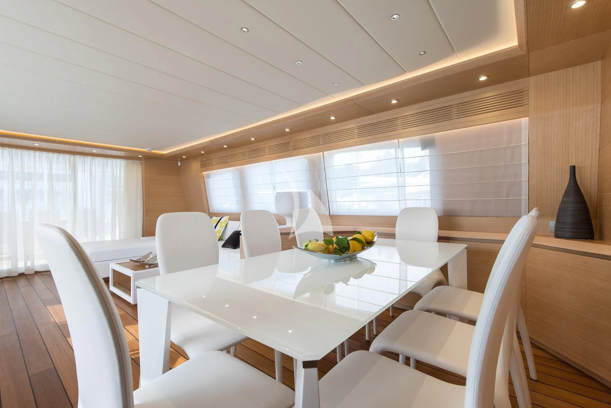 a room with tables and chairs aboard MIREDO Yacht for Sale