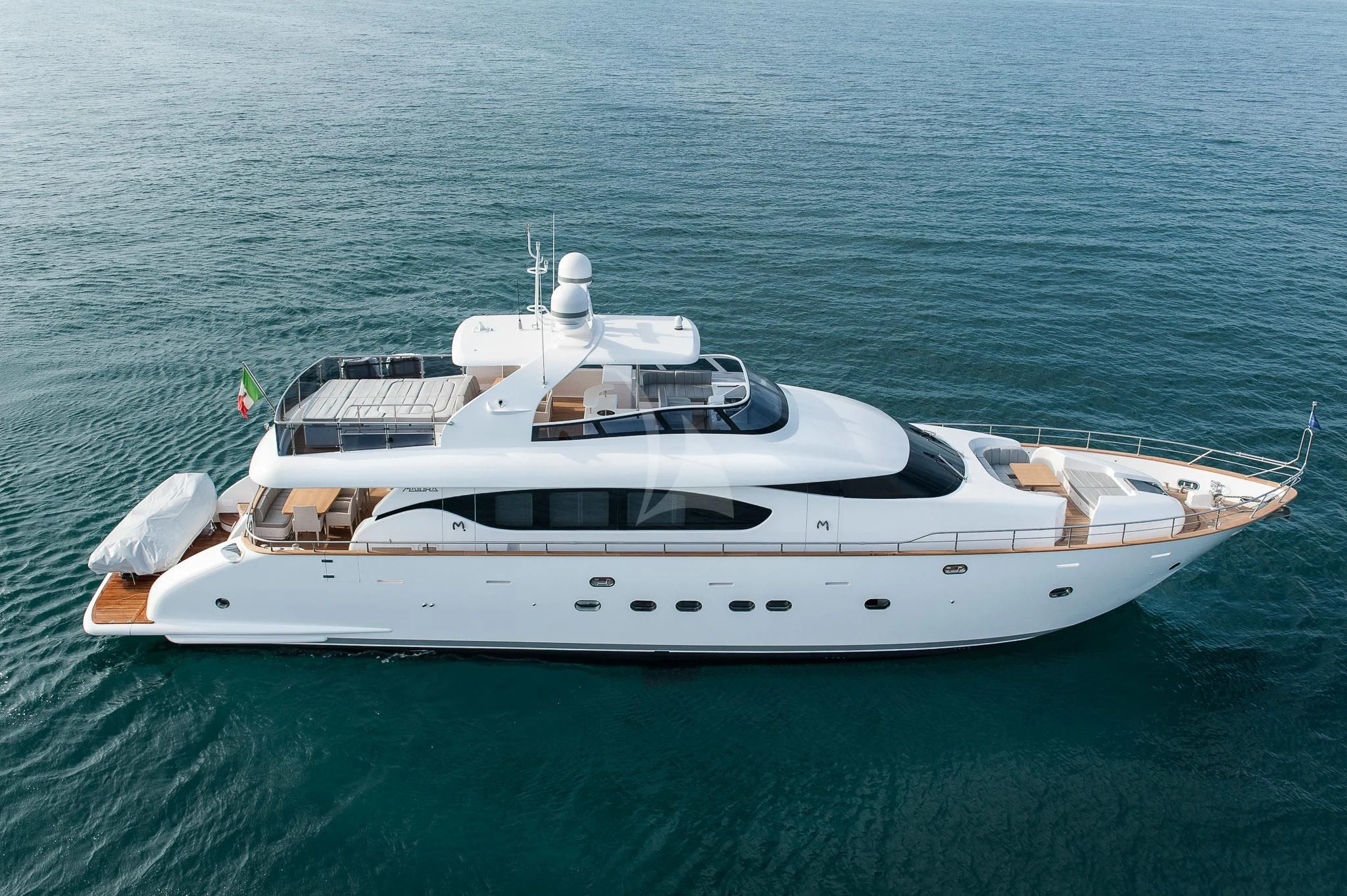 a white yacht in the water aboard MIREDO Yacht for Sale