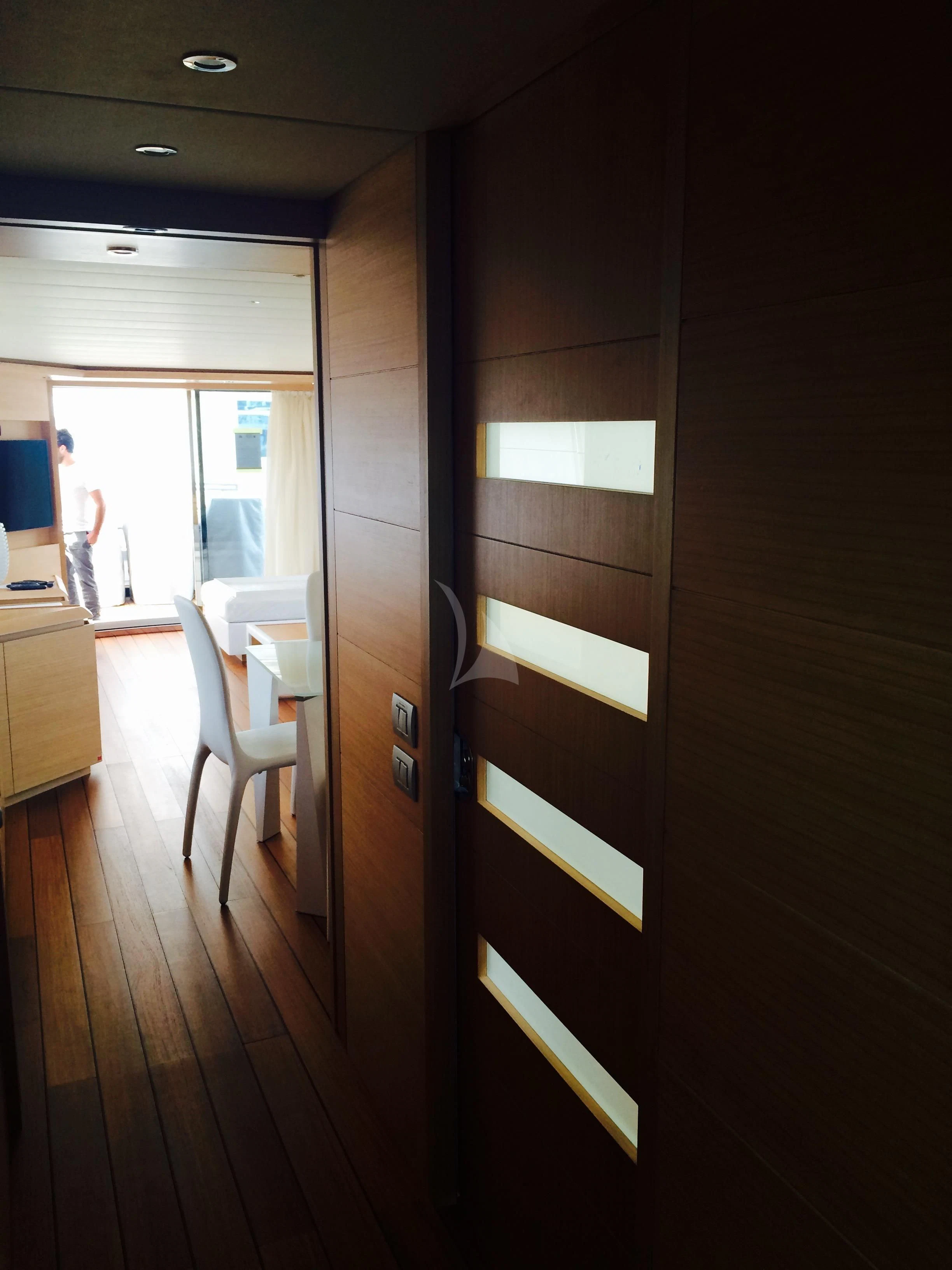 a room with a wood door and a black door aboard MIREDO Yacht for Sale