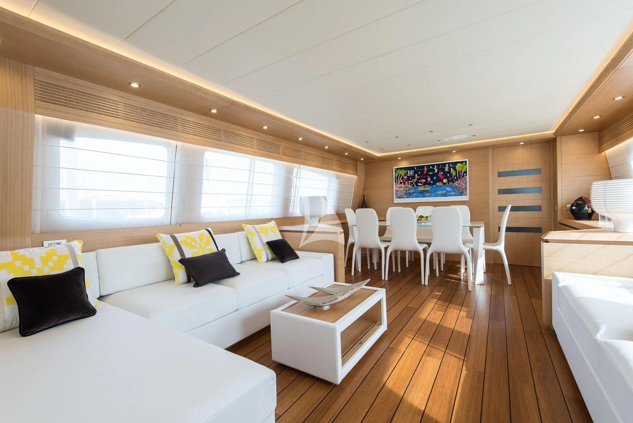a living room with a wood floor aboard MIREDO Yacht for Sale