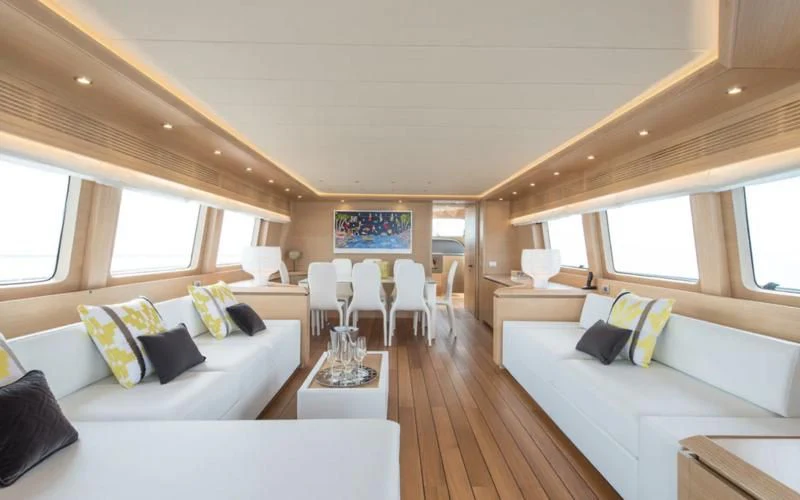 a room with a bed and a couch aboard MIREDO Yacht for Sale