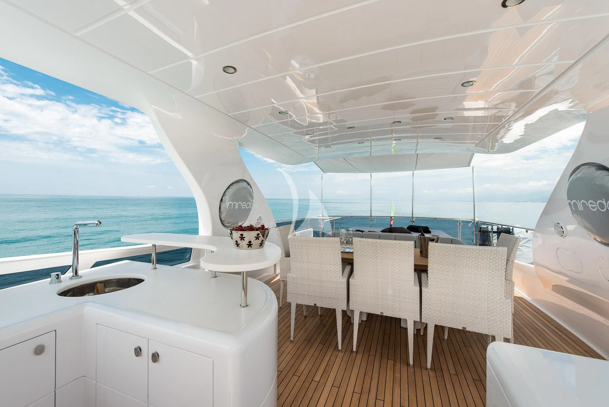 a boat with a table and chairs aboard MIREDO Yacht for Sale