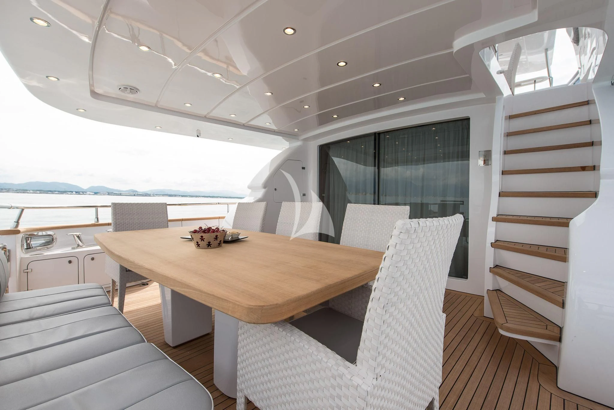 a room with a table and chairs aboard MIREDO Yacht for Sale