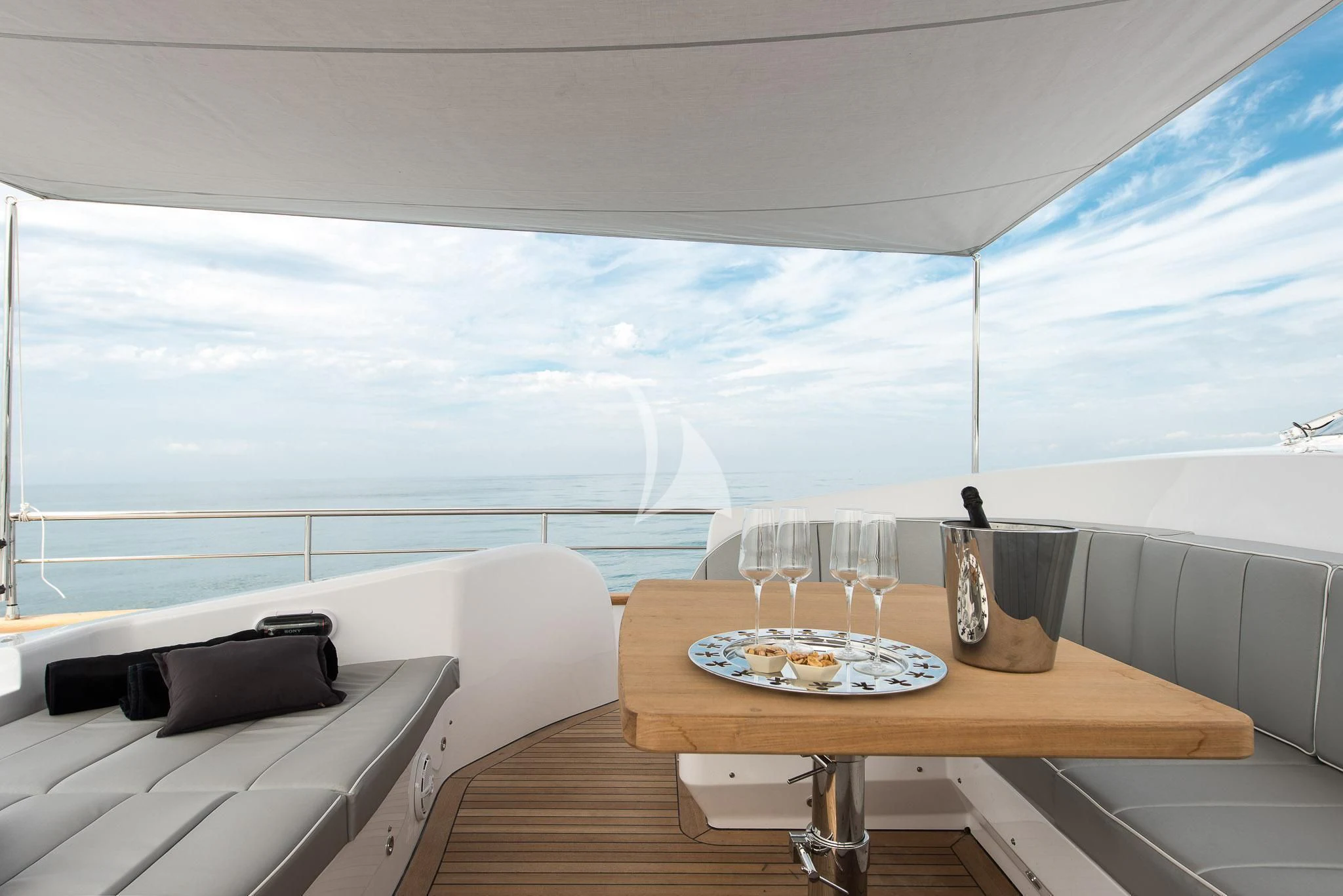 a room with a table and chairs aboard MIREDO Yacht for Sale