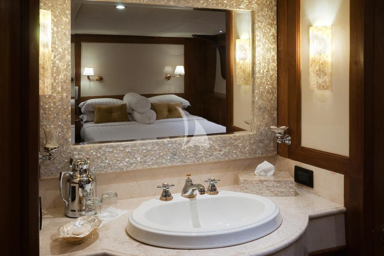 a bathroom with a large mirror aboard MUTIARA LAUT Yacht for Sale