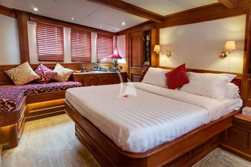a large bed in a hotel room aboard MUTIARA LAUT Yacht for Sale
