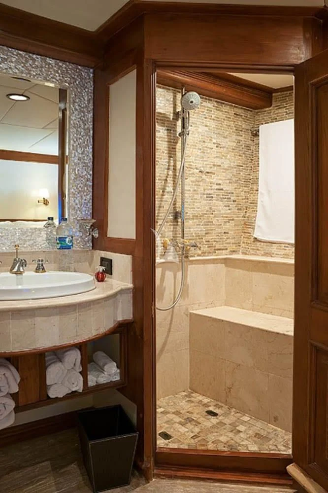 a bathroom with a sink and a bathtub aboard MUTIARA LAUT Yacht for Sale