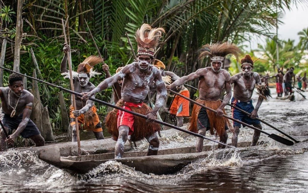 a group of people on a raft in a river aboard MUTIARA LAUT Yacht for Sale