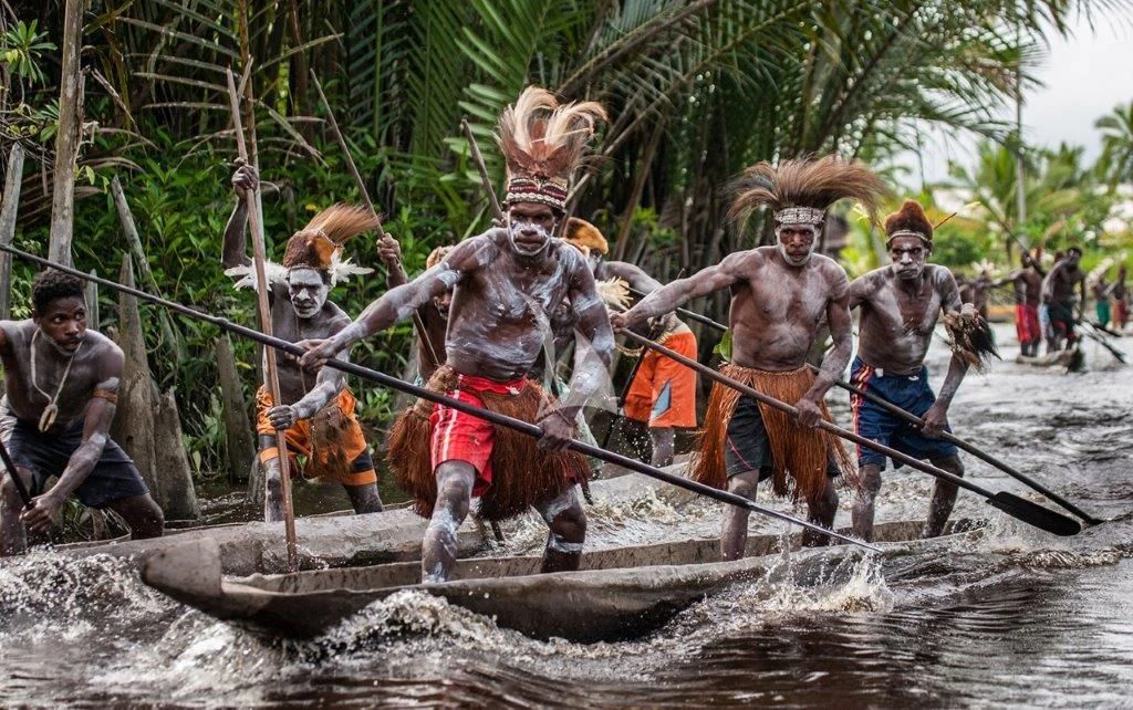 a group of people on a raft in the water aboard MUTIARA LAUT Yacht for Sale