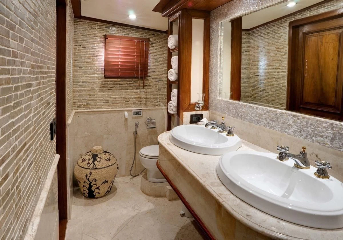 a bathroom with a sink toilet and a bathtub aboard MUTIARA LAUT Yacht for Sale
