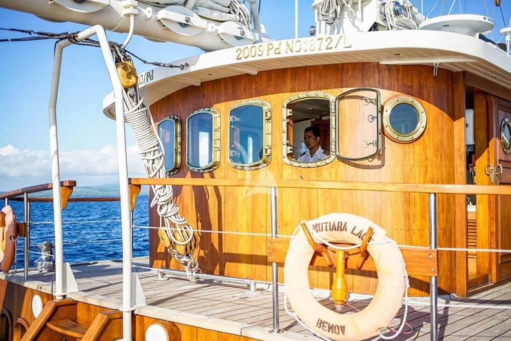 a yellow boat on a body of water aboard MUTIARA LAUT Yacht for Sale