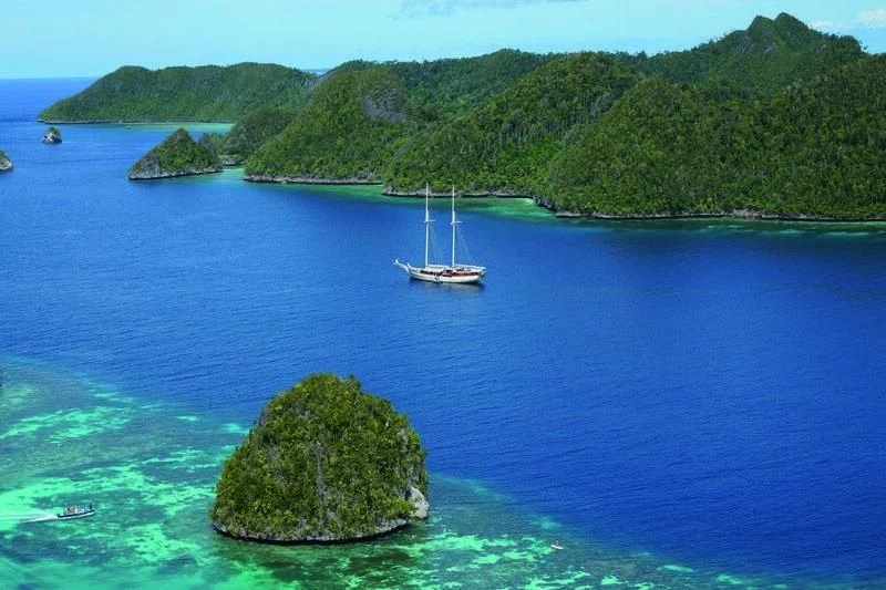 a sailboat on a large body of water aboard MUTIARA LAUT Yacht for Sale