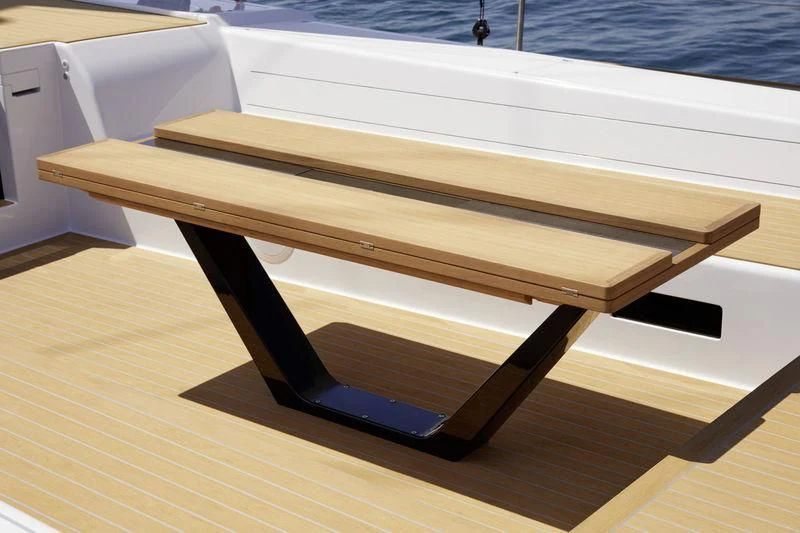 a wooden table on a boat aboard ALLSMOKE Yacht for Sale