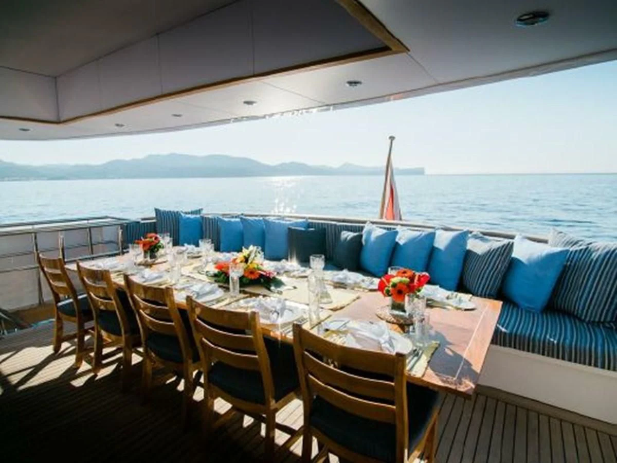 a table set for a dinner party aboard CHARISMA Yacht for Sale