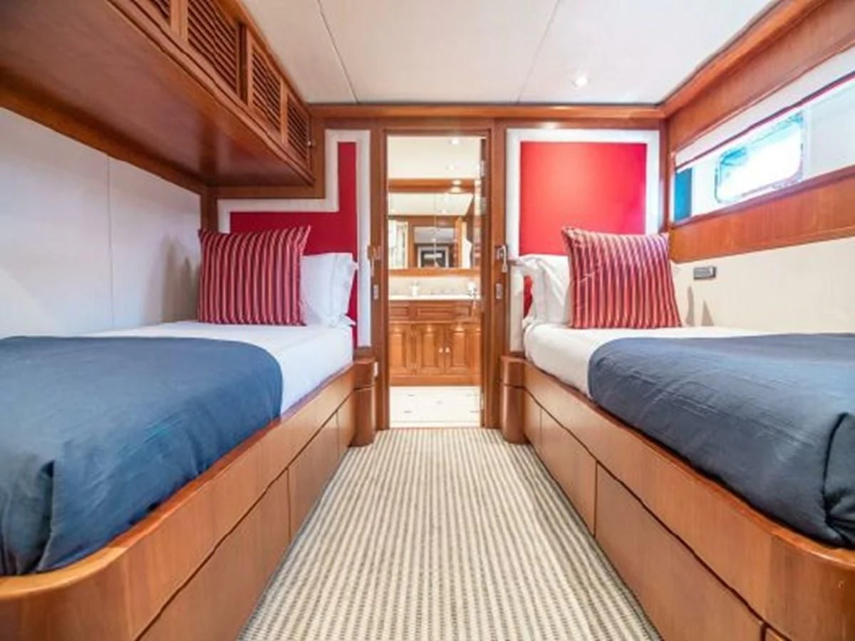 a couple of beds in a room aboard CHARISMA Yacht for Sale